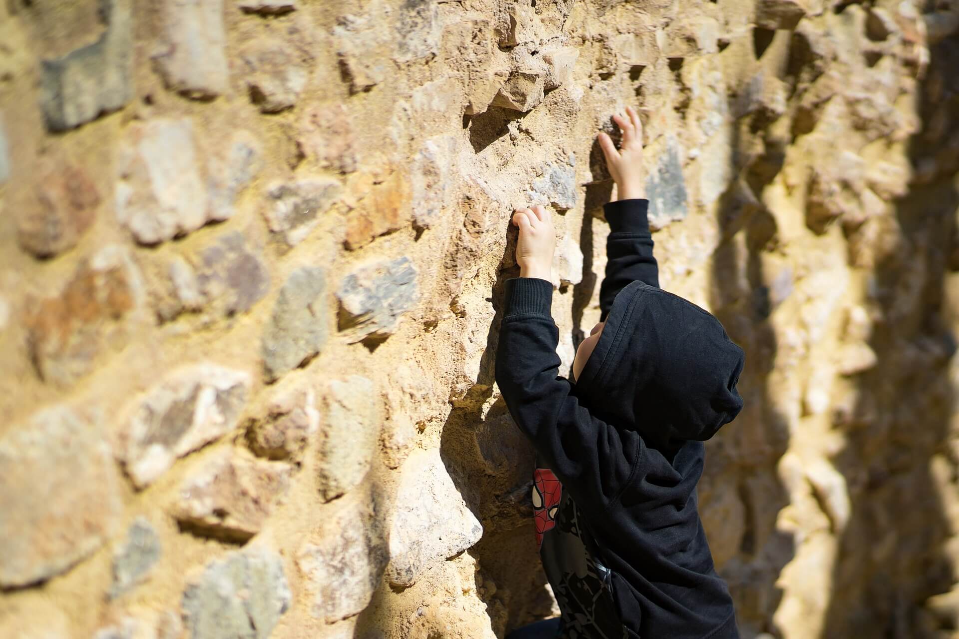 why does life suck? boy at a wall